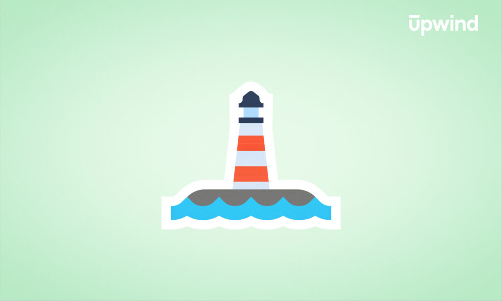 A vivid illustration of a red and white striped lighthouse stands on a small gray island, rising through blue waves against a light green background. "Zero-Day Attack Prevention Explained" is subtly inscribed in the top right corner, adding an intriguing layer to the tranquil scene.