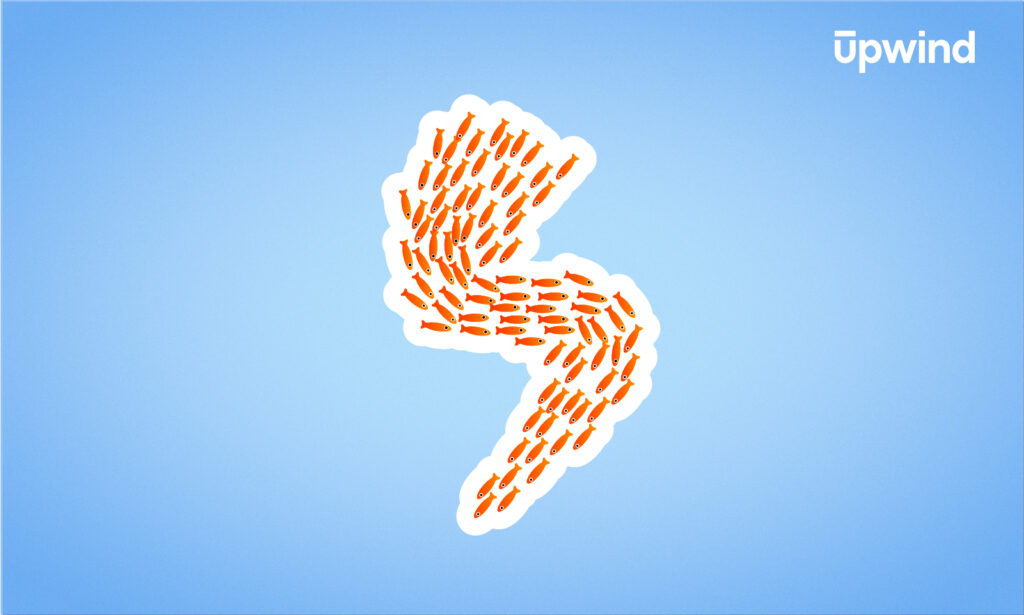 A blue background features a white outline of a lightning bolt, filled with rows of orange carrots, encapsulating an energetic juxtaposition. The phrase upwind graces the top right corner—a nod to innovative solutions akin to asking, What is AWS Lambda Runtime?.