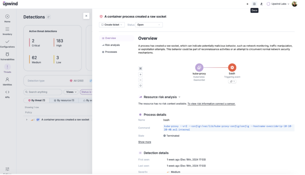 Screenshot of a dashboard displaying a security alert for a container process creating a new socket. The interface shows an overview, risk analysis, process details, and detection timeline with highlighted risk scores and timestamps.