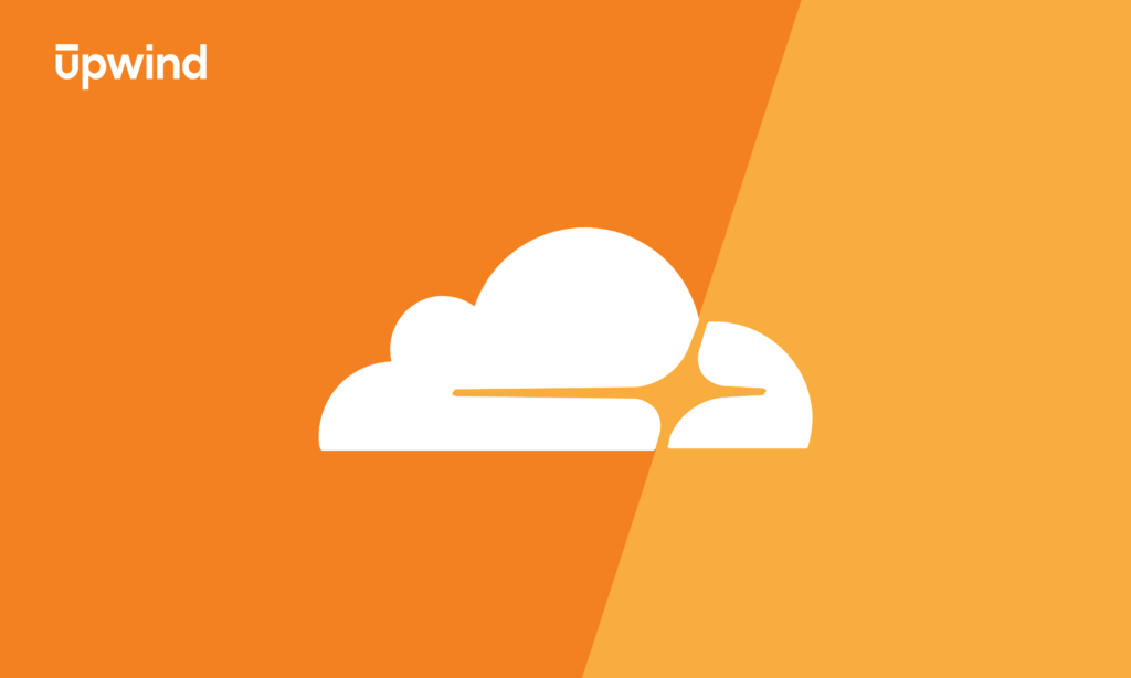 An orange and yellow background with a stylized white cloud design in the center. The word Upwind is at the top left corner in white text.